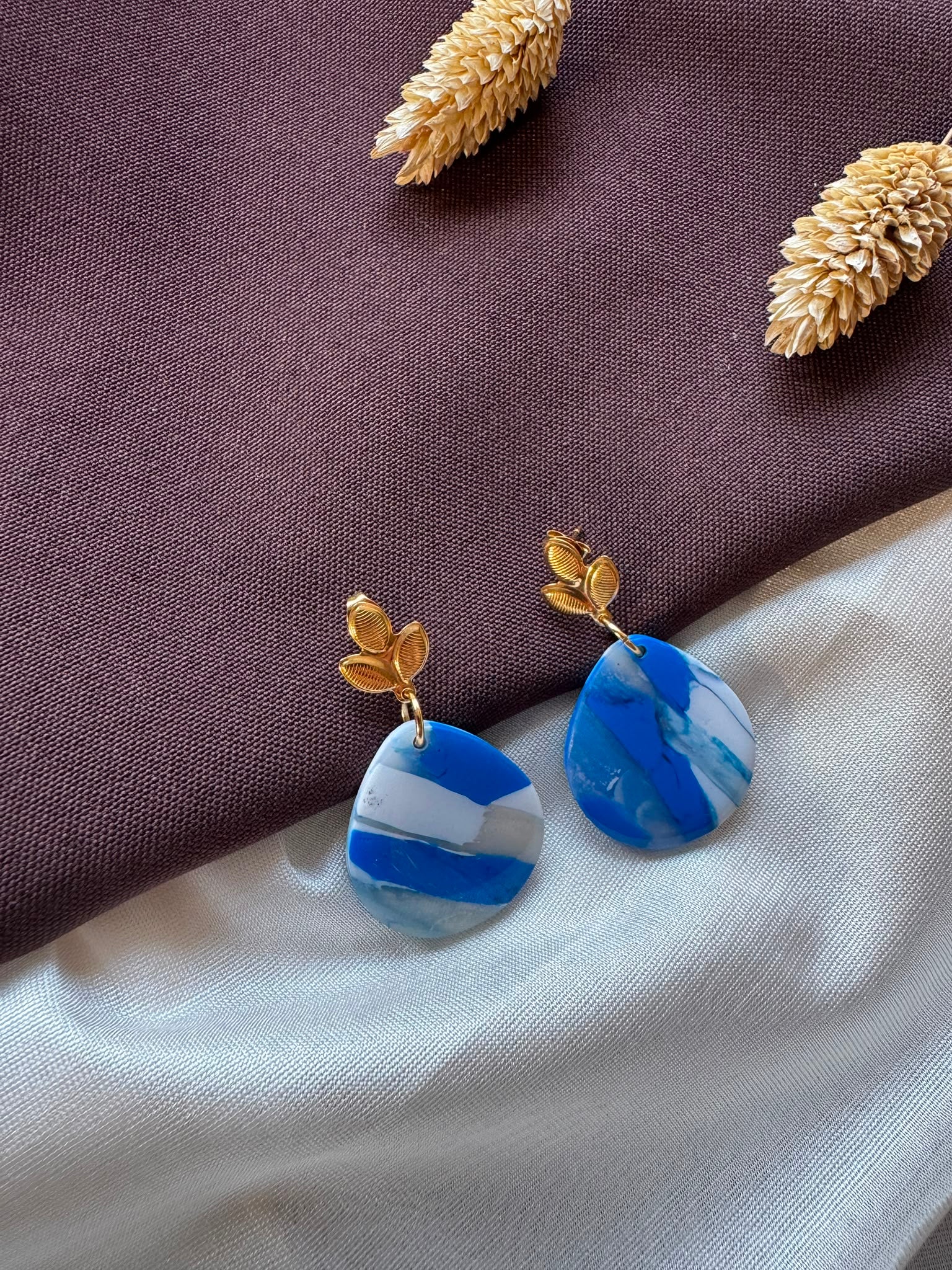 Oorbel blauw met goud
