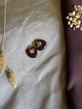Anne bruin met zilver of goud